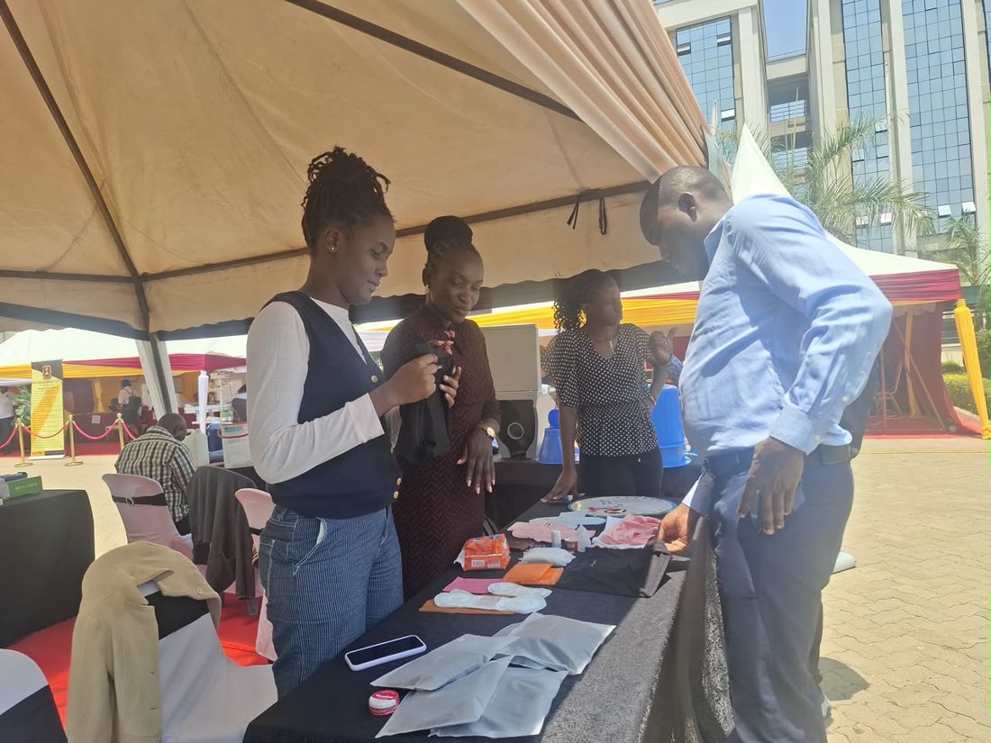 Exhibition table showcasing InclusiFit menstrual products.